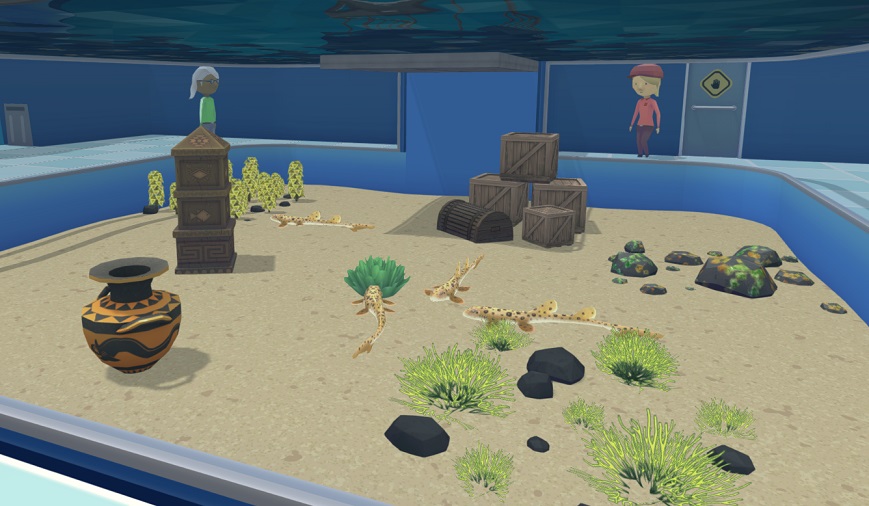 Een Voeder-Aquarium waarin vier Epaulethaaien op de bodem zwemmen, versierd met een Griekse Vaas, een Azteekse Zuil en een Krabbenval.