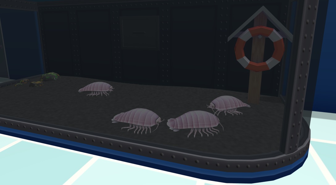 Vier Reuzenpissebedden lopen rond op de bodem van hun Diepzee-Aquarium. Achteraan rechts staat een Reddingsboei; links ligt een hoopje Levende Stenen.