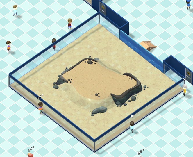 Vogelperspectief van een Island Beach-Aquarium. Het Aquarium is lang en breed, en heeft een 'eiland' in het midden. Diverse Bezoekers lopen voorbij het Aquarium.