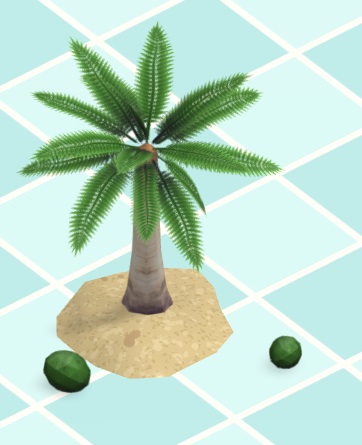 Vogelperspectief van een kleine Palmboom, met zand rond de onderkant van de stam. Twee groene kokosnoten liggen rond de boom.