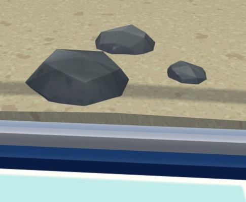 Drie kleine stenen op de bodem van een Aquarium.