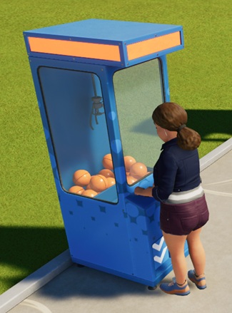 Een vrouw speelt met een blauwe Grijpmachine. Deze is smaller dan zijn collega-met-knuffels, en in plaats van knuffels is deze Automaat gevuld met oranje plastic bollen, waarin Tickets verstopt zitten.