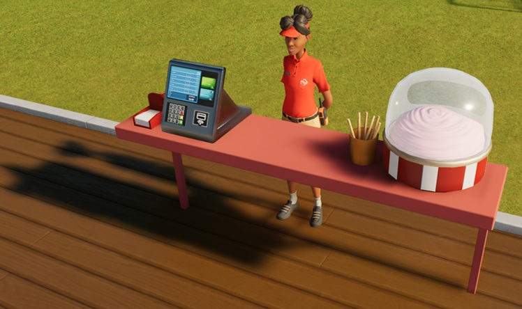 Een rode toonbank, met links de betaalterminal en servetten, en rechts een rood/witte, glazen bak vol gesmolten suiker. Naast de bak (links) staat een beker met lege stokjes. Middenin wacht de Verkoopster op Klanten.