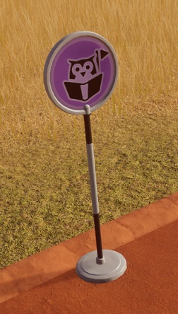 Close-up van een Stopplaats: een simpel rond bordje op een paal. Op het lila bord staat een pictogram van een lezende uil (!) met rechts daarvan een pictogram van een vlaggetje.