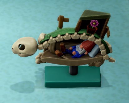 Zij-aanzicht van een Gardener Turtoise Skeleton, met de kop naar links gericht. Het is eigenlijk slechts een half skelet; het schild is 'open' en bevat een slapende kabouter.