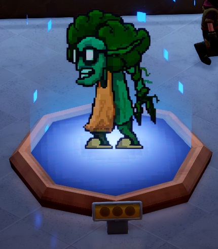 Een afbeelding van de Green Grosser, opgebouwd uit pixels, met vele kleine, vierkantige, blauwe partikels die rond het Museumstuk zweven. De Green Grosser is een groen monster met een bril, en groentenbladeren als haar; hij lijkt een schort en pantoffels te dragen. De 'grijper' aan de rechterkant zou een arm of een haarvlecht kunnen zijn.