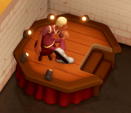 Een Modelling Station is een achthoekig houten podium met een trapje aan één zijde, en vijf spots aan de tegenovergestelde zijden. Een Assistent poseert op een krukje in de houding van Rodins 'De Denker'.