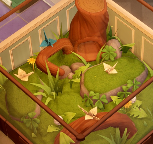 Vier Paper Cranes in hun Terrarium. De 'Vogels' zijn gevouwen uit papier en zijn geelwit, behalve de Vogel linksboven (die is blauw).