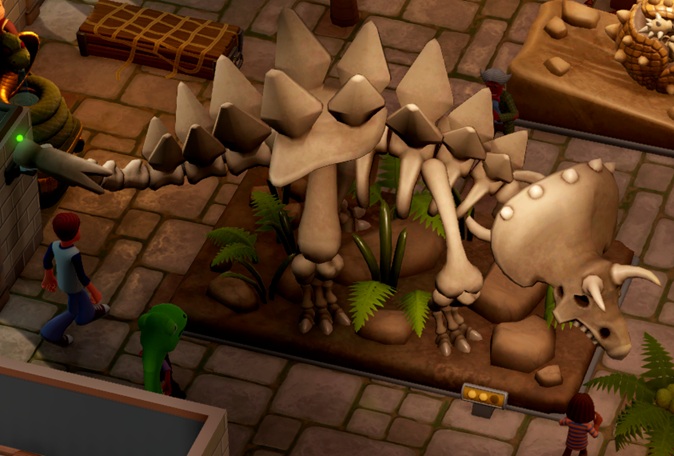 Een Sharpontops-geraamte, omringd door een gewone Bezoeker (links) en een Kind (rechtsonder). Links is een muurcamera zichtbaar. Midden bovenaan staat een Professor. De Sharpontops ziet eruit als een Triceratops, maar met de scherpe rugplaten van een Stegosaurus, en een Hamer als staart (moeilijk zichtbaar op de foto).