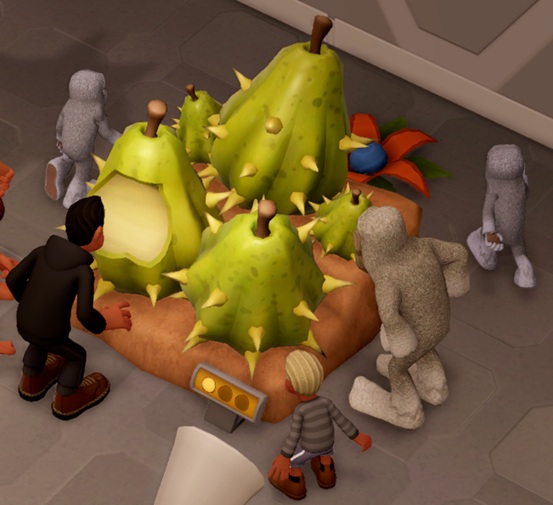 De Sickly Pear ziet er in Two Point Museum helemaal anders uit dan de Prickly Pear uit Het Ware Leven: de Plant bestaat uit vier grote Peren, met stekels op de vruchten. Vele Bezoekers bekijken de Plant.