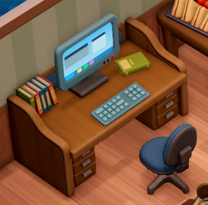 Een bureau met een werkende computer erop. Naast het scherm staat een rijtje gerangschikte boeken.